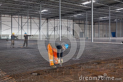 Steel fixer at work in a ware Editorial Stock Photo