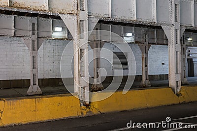 Steel girders holding up overhead train pass Stock Photo