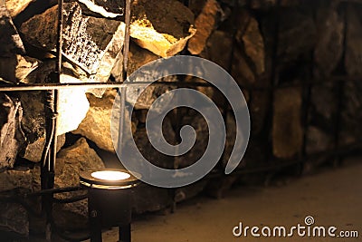 Steel grating to put stone into the interior wall of the restaurant With the use of light uplights Stock Photo