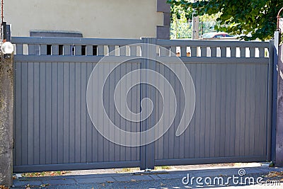 Steel gray street gate aluminum portal of suburb home Stock Photo