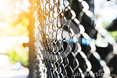 Steel net fence perspective view, selective focus with shallow depth of field Stock Photo