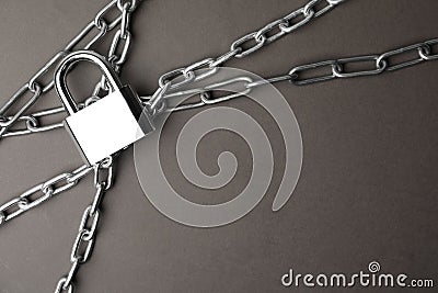 Steel padlock, chains and space for text on background, flat lay. Safety concept Stock Photo