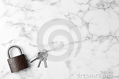 Steel padlock, keys and space for text on white background, top view. Safety concept Stock Photo