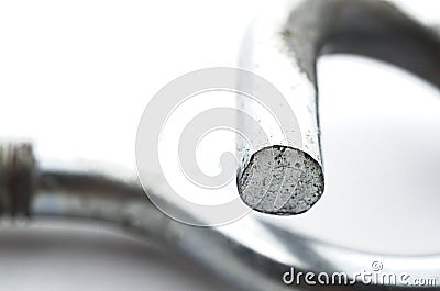 Steel pigtail screw hook on white background. Stock Photo