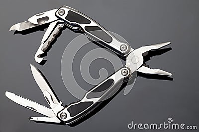 Steel pliers folding multi tool opened Stock Photo