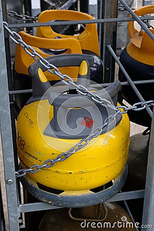 Close-up pressurized gas cylinders in a rack Editorial Stock Photo