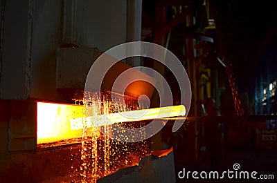 Steel quenching at high temperature in industrial furnace at the workshop of a forge plant. Process of cooling, heat treatmen. Stock Photo