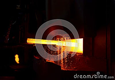 Steel quenching at high temperature in industrial furnace at the workshop of a forge plant. Process of cooling, heat treatmen. Stock Photo