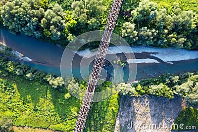 Steel railroad bridge above a small river Stock Photo