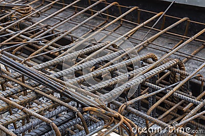 Steel reinforcing tie wire work at construction site of embankment for canal path and protecting riverbank collapse structures. Stock Photo