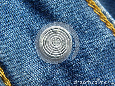 Steel rivet on blue jeans Stock Photo