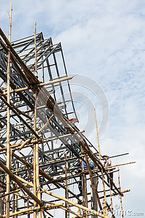 Steel roof truss workers. Editorial Stock Photo