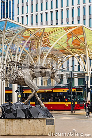 Steel sculpture of a unicorn half melting in the air by Tomohiro Inaba at city center next to Editorial Stock Photo