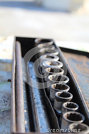 A steel socket tool in a rusty box Stock Photo