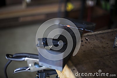 Steel support cools after welding the two together. Stock Photo