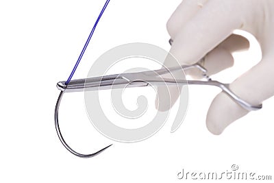 Steel surgical forceps holding a suture needle Stock Photo