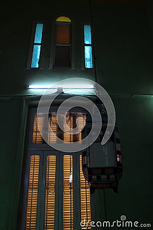 A steel vintage lamp with a colorful window in the mosque of Abou el oyoun in Assuit Stock Photo