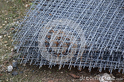 Steel wire net on the ground Stock Photo