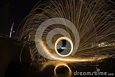 Steel wool light painting at a skate park ramp Stock Photo