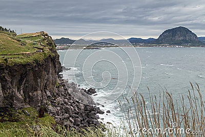 Steep cliff next to Songaksan Mountain on Jeju Island Stock Photo