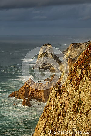 Steep coastline and stormy clouds Stock Photo