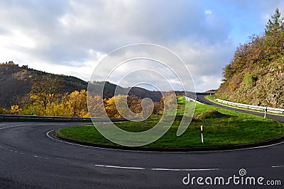 empty hairpin curve of a country road Stock Photo