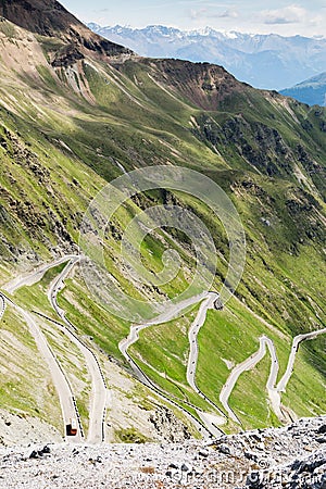 Steep descent of mountain road Stelvio pass, in Italian Alps, Stelvio Natural Park Stock Photo