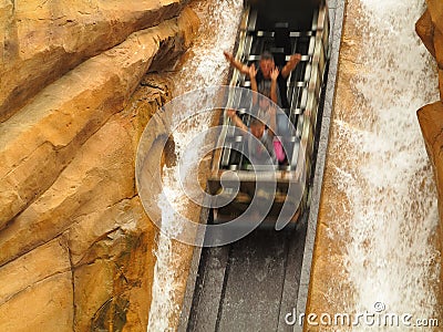 Log flume ride steep drop in cliff family fun motion blur Editorial Stock Photo