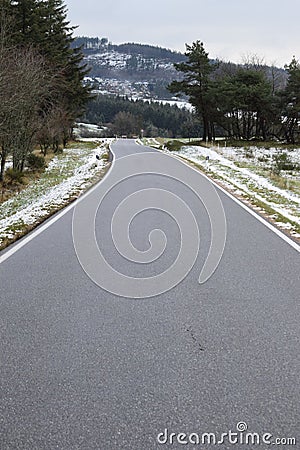 steep Eifel road with a sudden curve in the valley, Arft Stock Photo