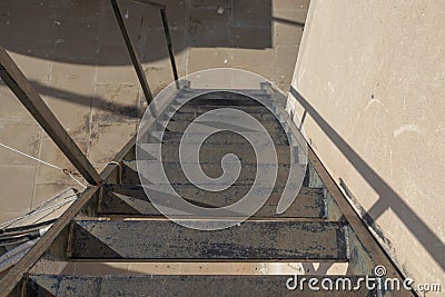 Steep metal stairs. Dangerous metal staircase Stock Photo