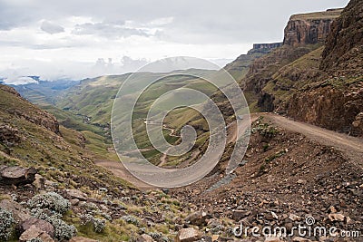 Steep winding mountain road of Sani Pass between South Africa and the Kingdom of Lesotho Stock Photo