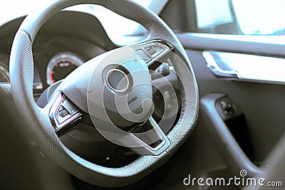 Steering and instrument panel in the car close-up. Right-hand drive. The latest technology and brand cars. Driving and transport Stock Photo