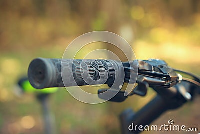 Steering wheel bike close-up on a green forest background Stock Photo