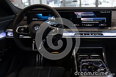 steering wheel, center console bmw 7er Limousine G70, luxurious powerful bmw i7 all-electric sedan, Electric Vehicles, Advanced Editorial Stock Photo