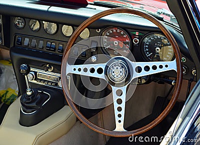 Steering wheel gear stick and dashboard of classic E type Jaguar car. Editorial Stock Photo