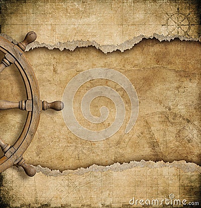 Steering wheel and torn vintage nautical map Stock Photo