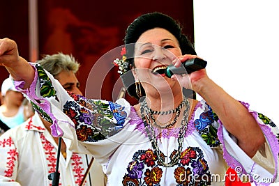 Stefania Rares singing for Romanians from Italy. Editorial Stock Photo