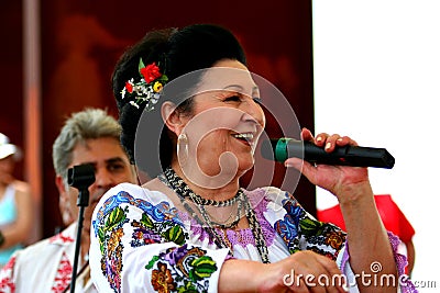 Stefania Rares singing for Romanians from Italy. Editorial Stock Photo