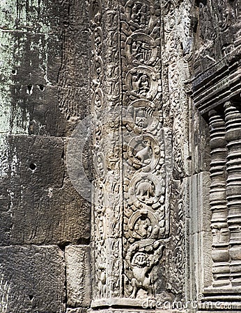 Stegosaurus dinosaur carving on the wall in Ta Prohm temple, Siem Reap, Cambodia Stock Photo