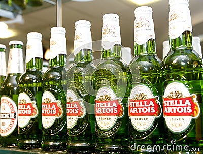 Stella Artois beer bottles at the bar Editorial Stock Photo