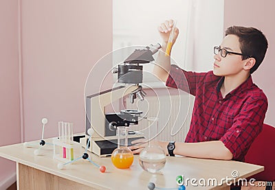 Stem education. Teenage boy make chemical research Stock Photo