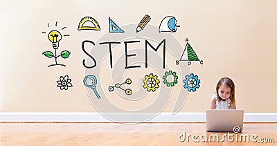 STEM text with little girl using a laptop computer Stock Photo