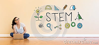 STEM text with young woman using a laptop computer Stock Photo