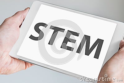 STEM & x28;science, technology, engineering, math& x29; concept with text being displayed on modern touch screen of a white tablet Stock Photo