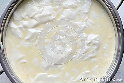 Step cooking cottage cheese, sourdough milk in a saucepan Stock Photo