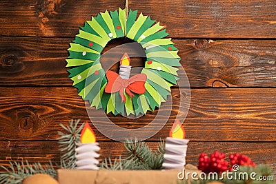 How to make christmas wreath from color paper with children. Step by step instructions. Handmade DIY new year holiday decoration p Stock Photo