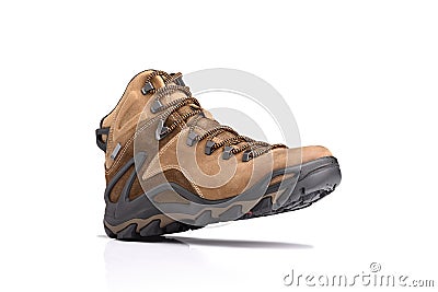 Step walking, single brown leather hiking boots. Stock Photo