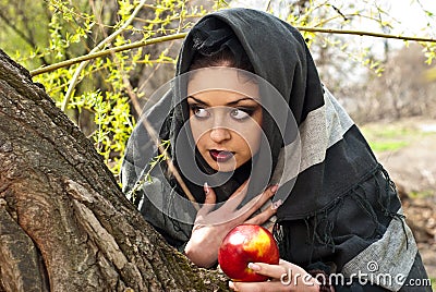 Stepmother casts a spell over the apple Stock Photo