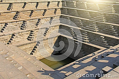 Stepped tank with green water in Pushkarani, Hampi, Karnataka, I Stock Photo