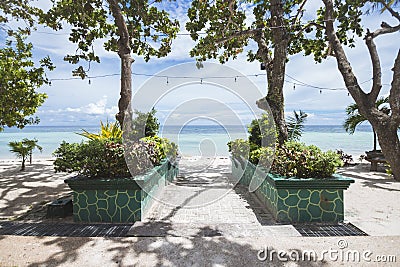 Steps with landscaping leading down to the beach. At Dumaluan Beach in Panglao Island, Bohol, Philippines Stock Photo